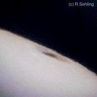 sun spot on right site of the sun - on 2004, January 1 -(recorded behind the 9 mm eyepiece (138x) with a 1.3 Mpxl praktika digital camera)