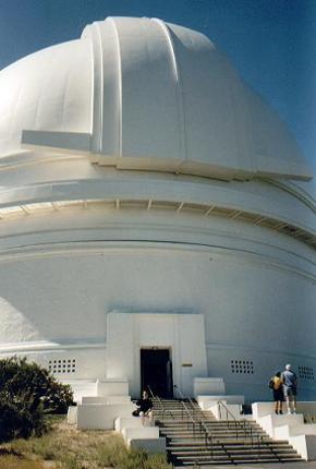 I sit here on the stairs in front of the  5m Hale Telescope Dome